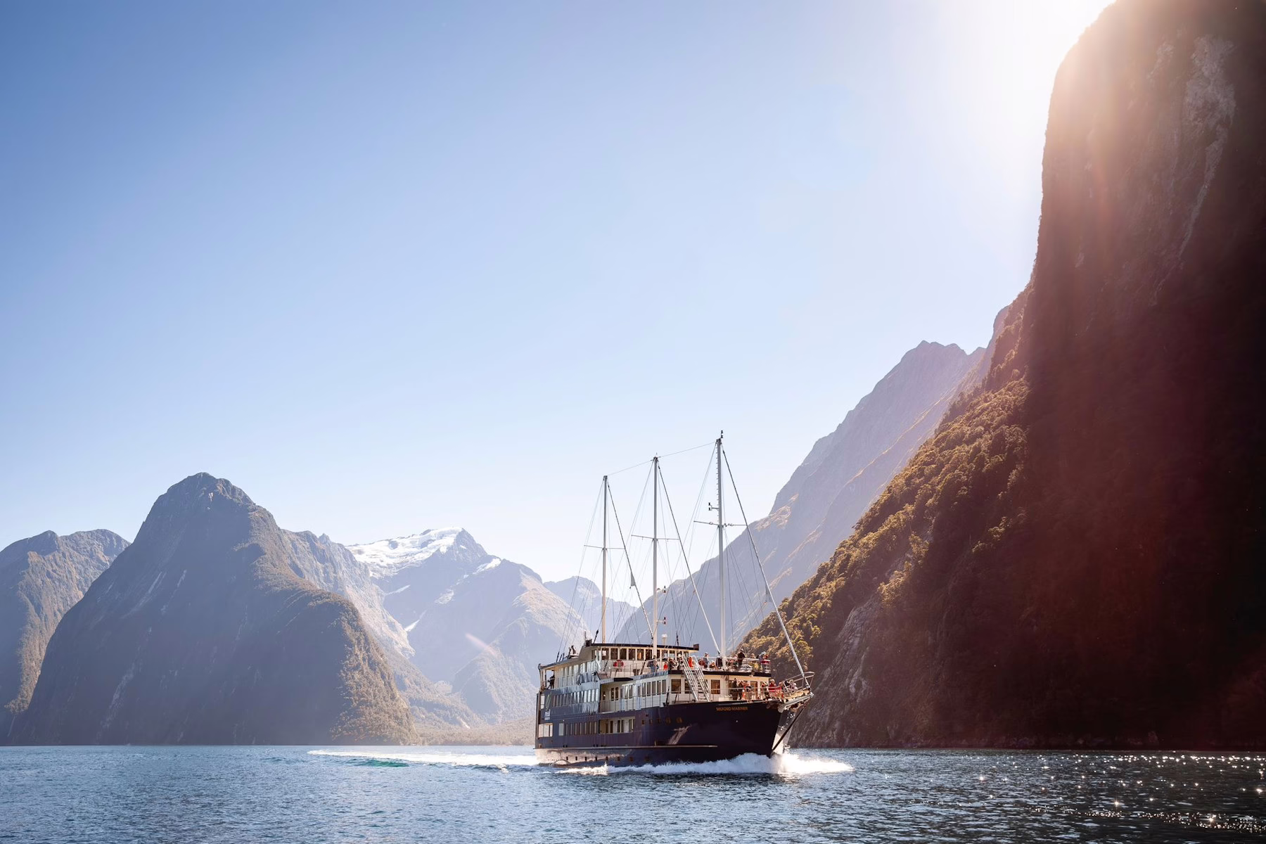 Image shows a boat tour of Milford Sound, New Zealand